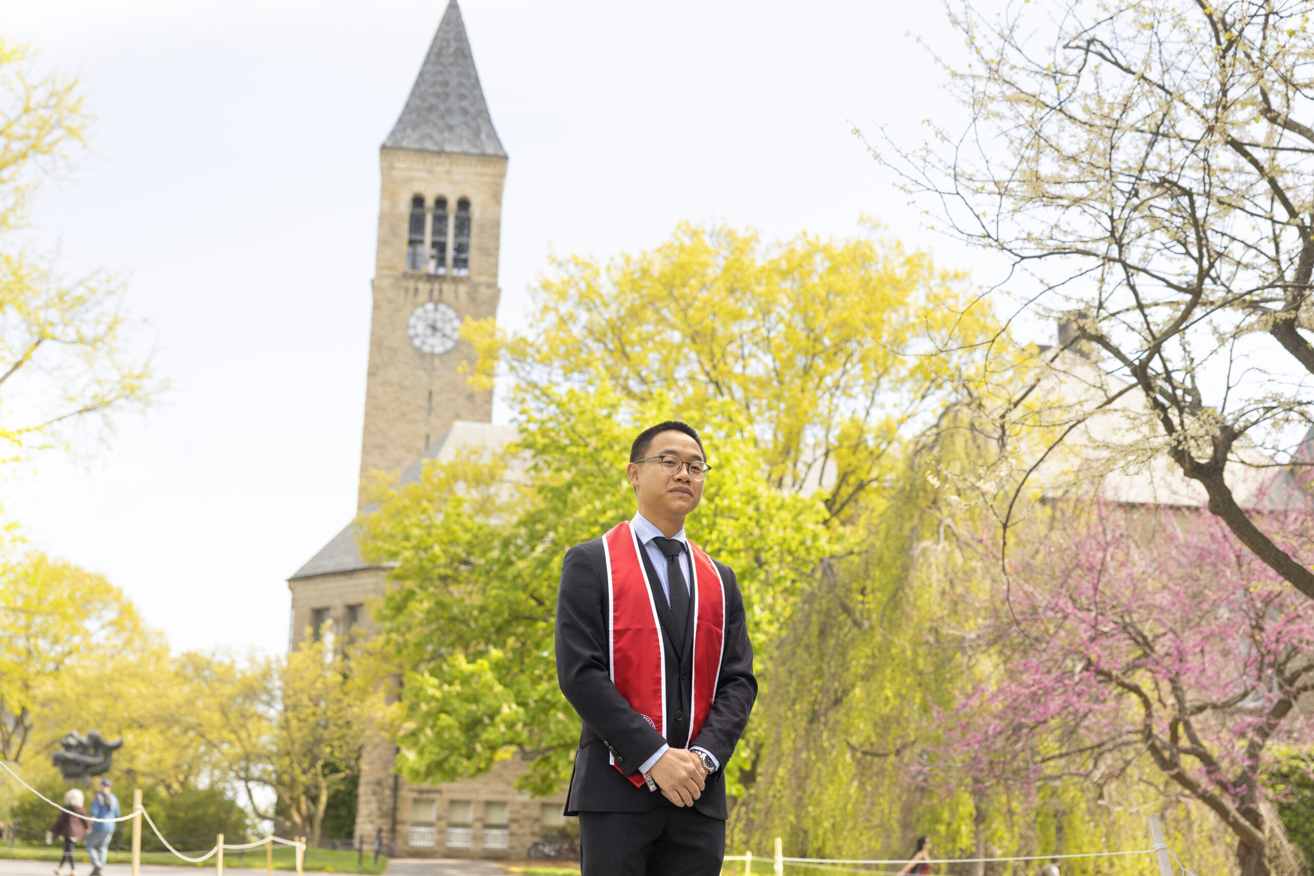 Student in graduation gard on the Arts Quad